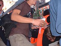 D_organizers_handing_out_cargo_cellphones.jpg
